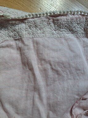 These Cynthia Rowley 100% linen shorts feature a light pink and white micro-stri